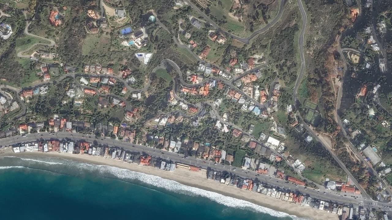 Aerial view of Malibu before wildfire - lush, intact neighborhood